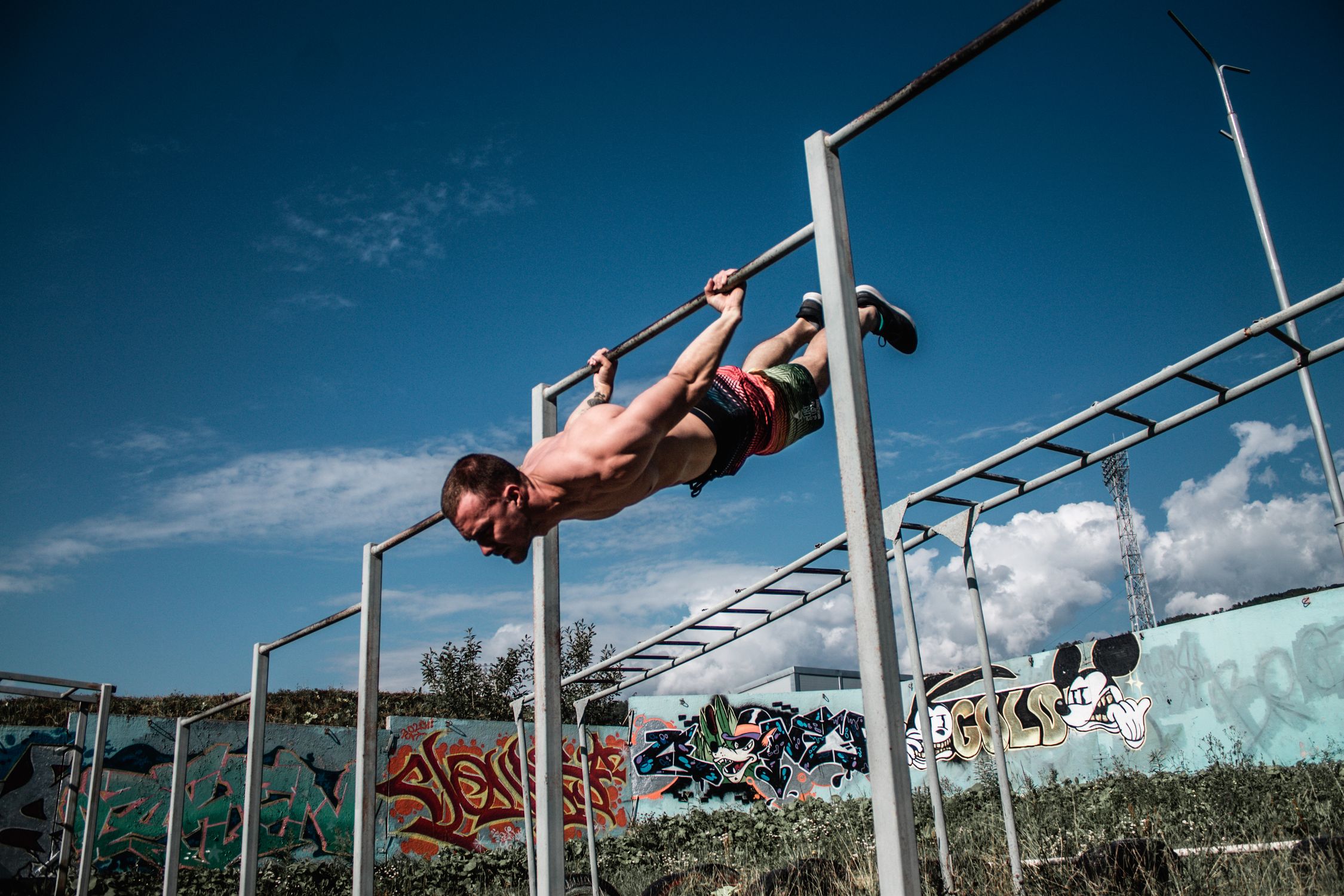 Exercise Outside Men Photo of a Man Exercising on an Outdoor Gym ยท Free Stock Photo