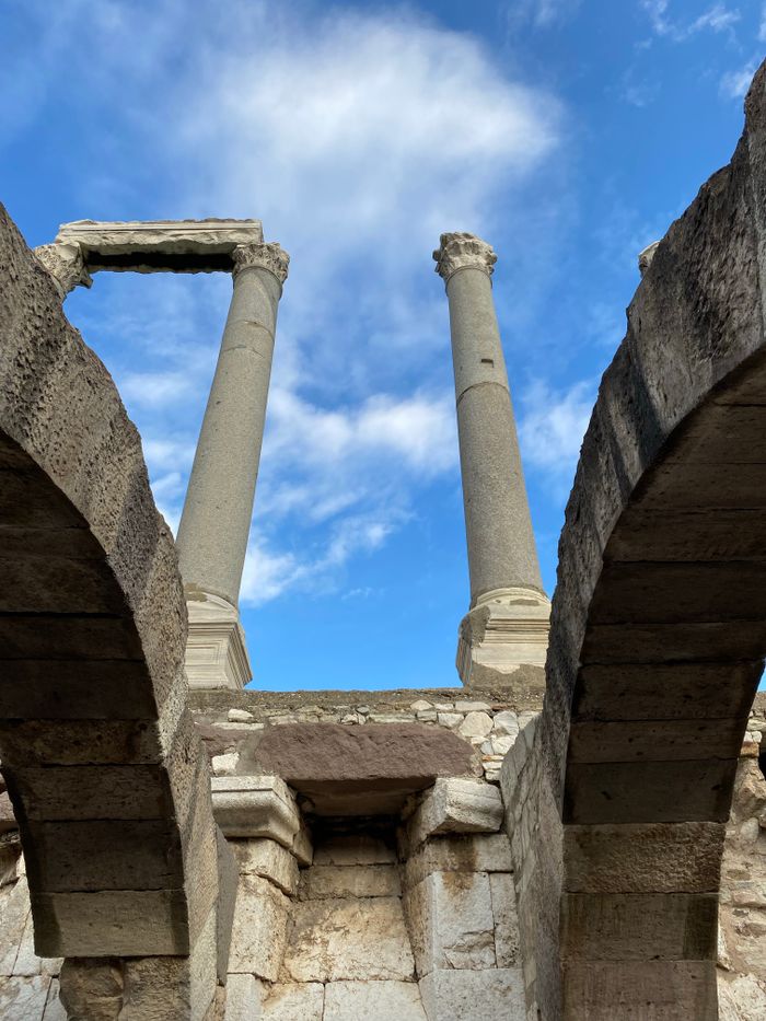 Ancient Roman columns against blue sky