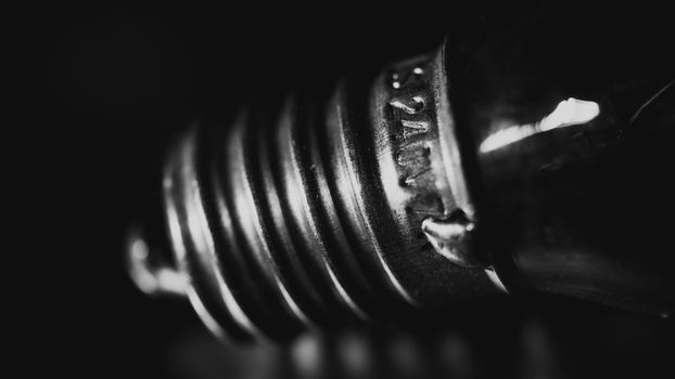 Artistic macro shot of a light bulb base in monochrome.