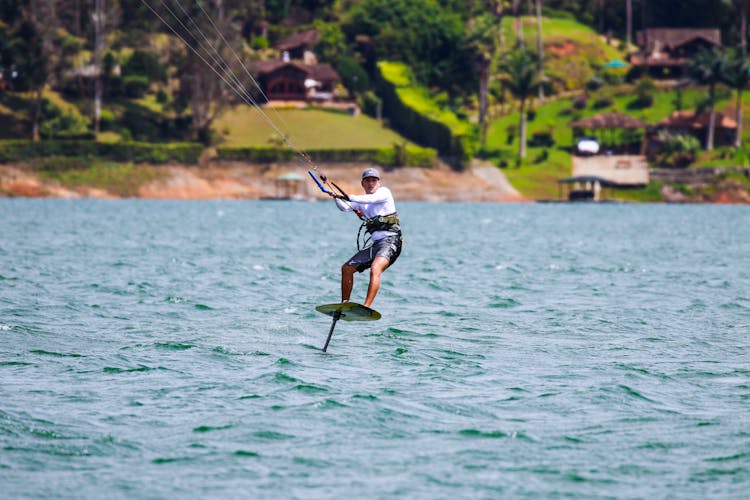 A Man Doing A Water Activity On A Body Of Water