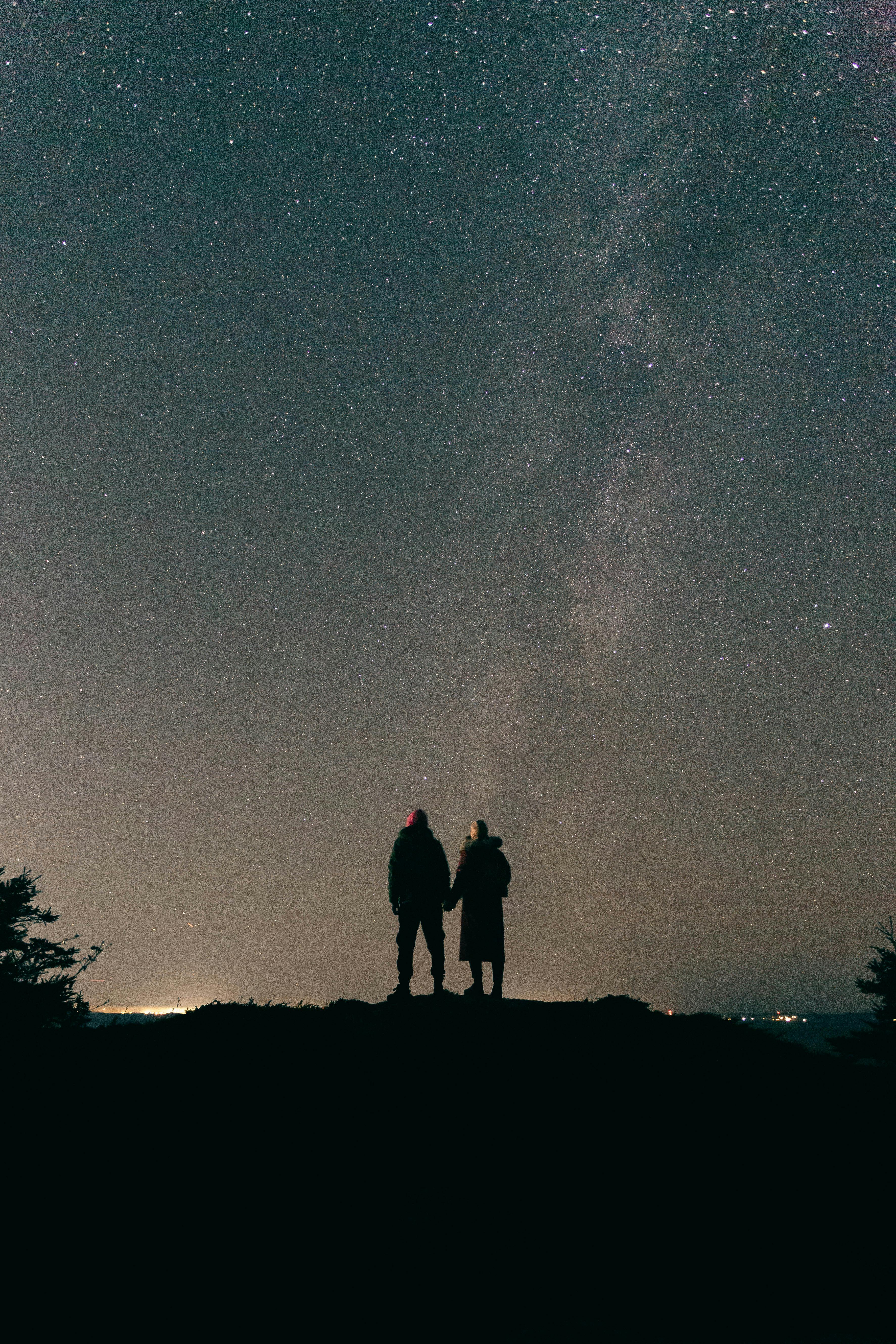 Couple Standing under Starry Sky at Night · Free Stock Photo