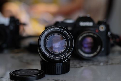 Free Close-up shot of a vintage Konica camera lens with focus on optical details. Stock Photo