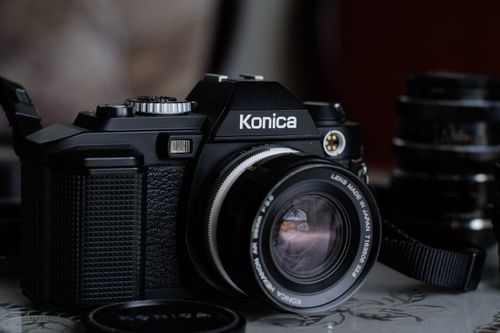 Free Close-up of a vintage Konica SLR camera with lens. Perfect for photography enthusiasts. Stock Photo