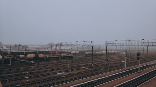 Tracks on a Train Station on a Foggy Winter Day