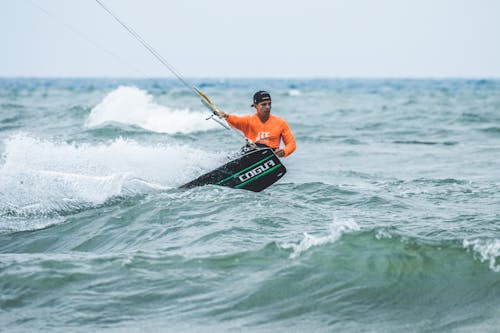 Man Doing Kite-Surfing on Sea