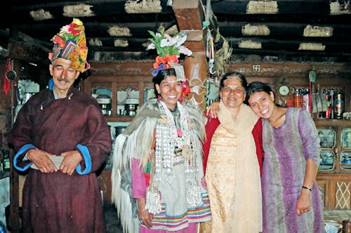 Smiling Women and Man in Traditional, Tribal Clothing