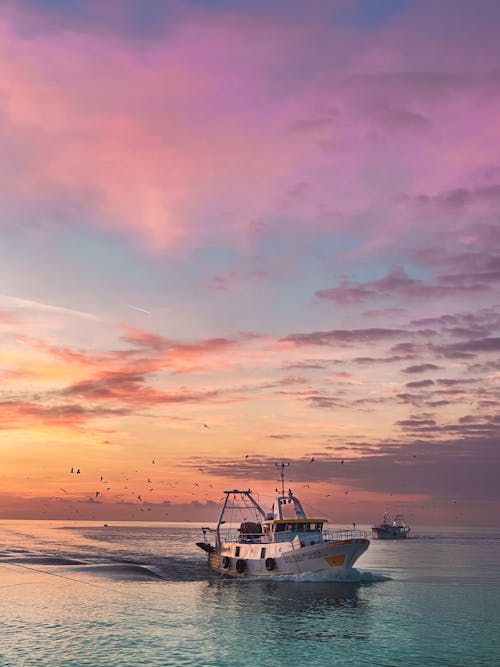 Scenic View of a Boat on the Sea during Sunset