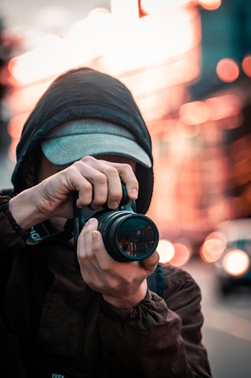 Close Up Photo of Person Taking Photo with a Camera