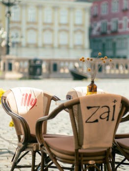 Charming outdoor café setting in Timișoara, Romania with blurred background.