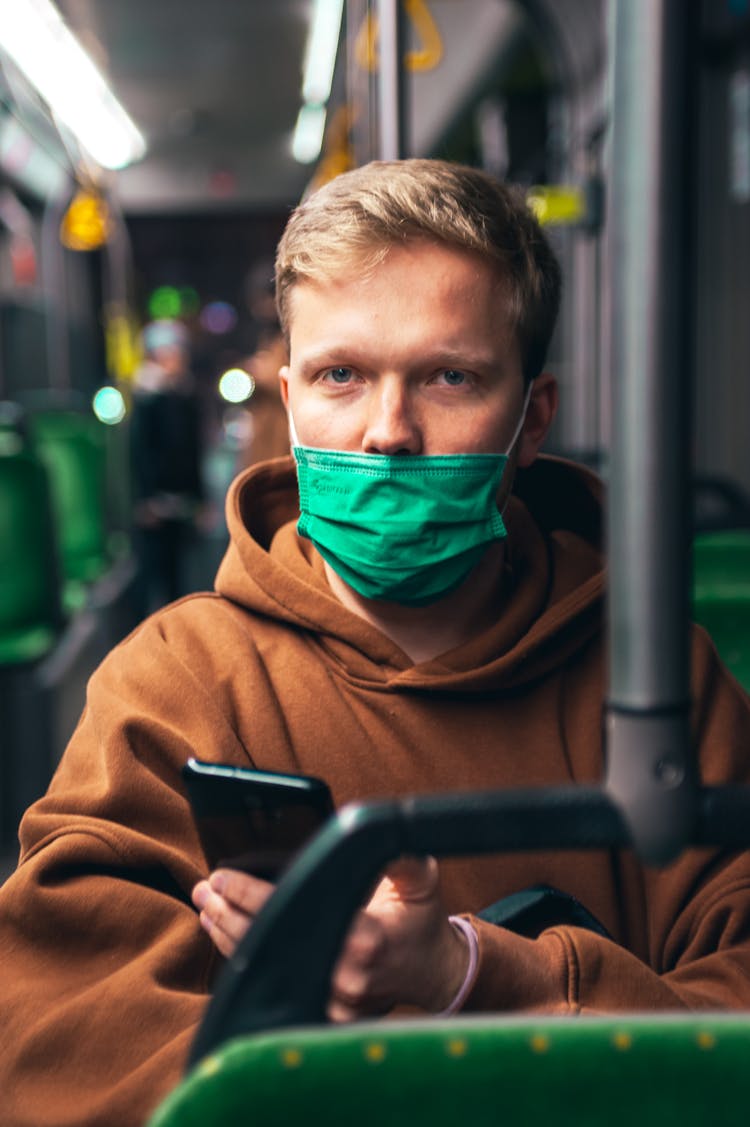 Man Wearing Face Mask Under His Nose In Public Transportation