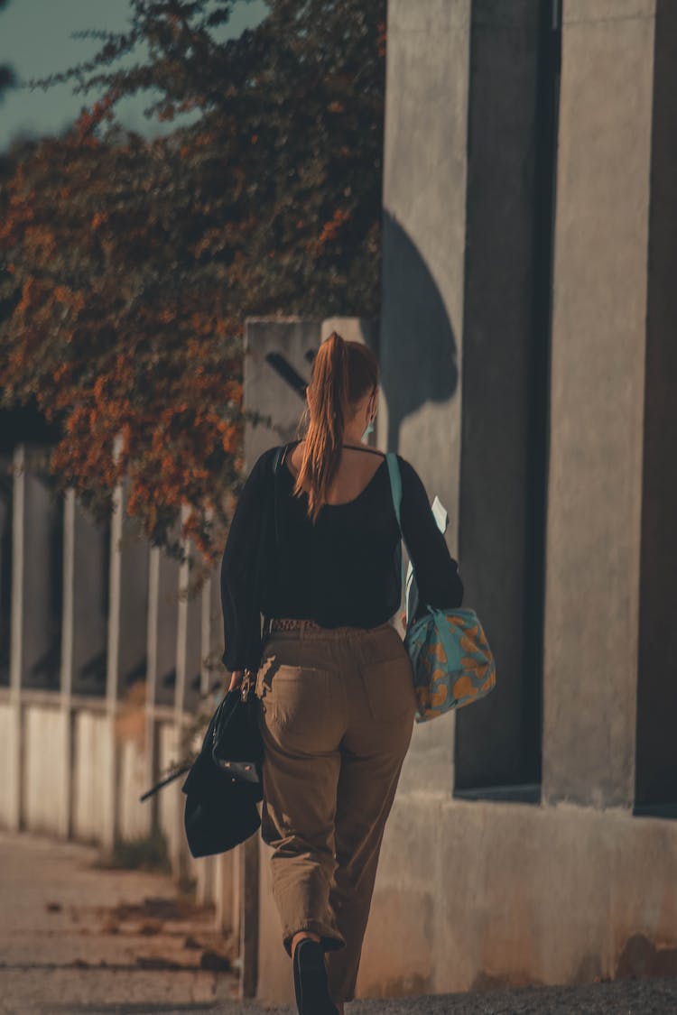 Woman Walking With Bags