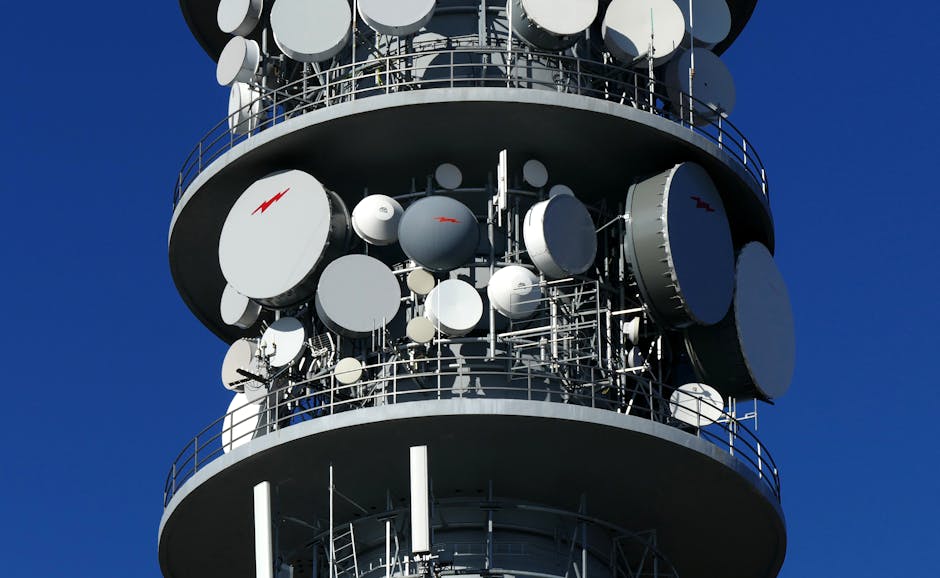 Close-up of a telecommunication tower with multiple satellite dishes in Croatia.