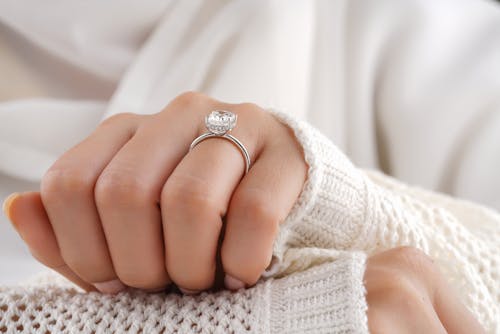 Person Wearing Silver Diamond Ring