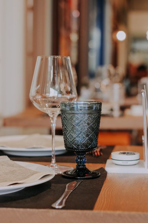 Free Close-up view of a sophisticated dining setting with glassware on a table, highlighting elegance. Stock Photo