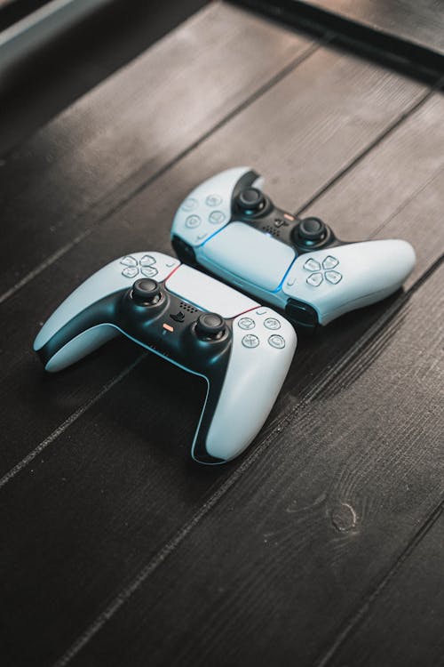 A Game Controllers on a Wooden Table