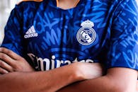 Man in Blue and White Adidas Jersey Shirt