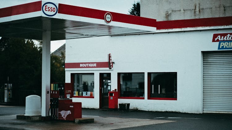 A Red And White Esso Gas Station