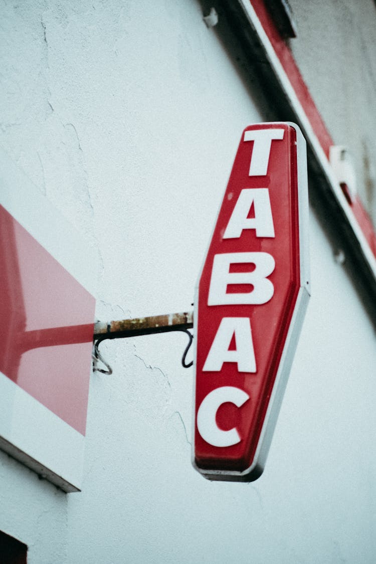 Old Store Sign Hanging From Wall