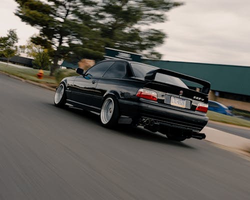 A Black Car Running Fast on the Road