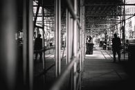 Grayscale Photo of People Walking on Sidewalk