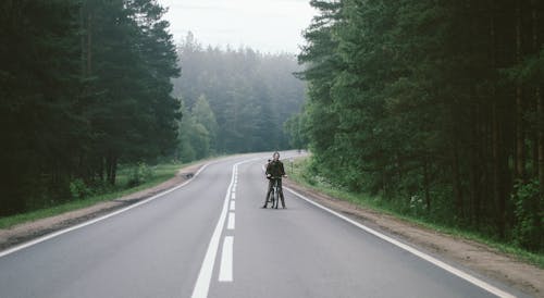 Free Man With Black Bicycle Stock Photo