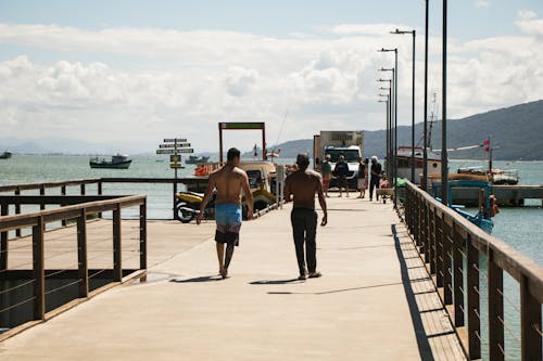 Free People Walking on Dock Stock Photo