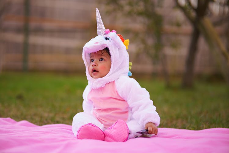 A Baby In Unicorn Costume
