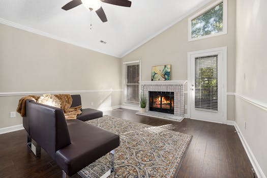 Bright and inviting living room featuring a modern sofa, fireplace, and elegant decor.