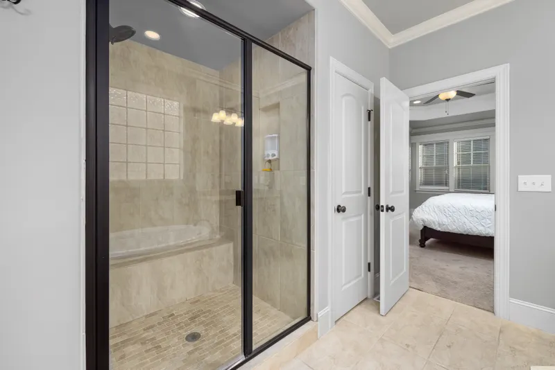 Framed glass shower door with metal frame