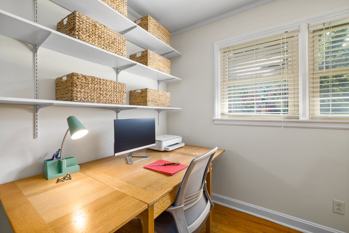 Free Wooden Desk and Chair on a Home Office Room Stock Photo