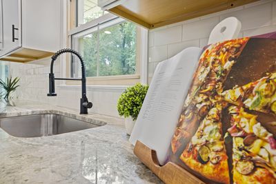 Honed marble countertop with modern sink — kitchen renovation material detail