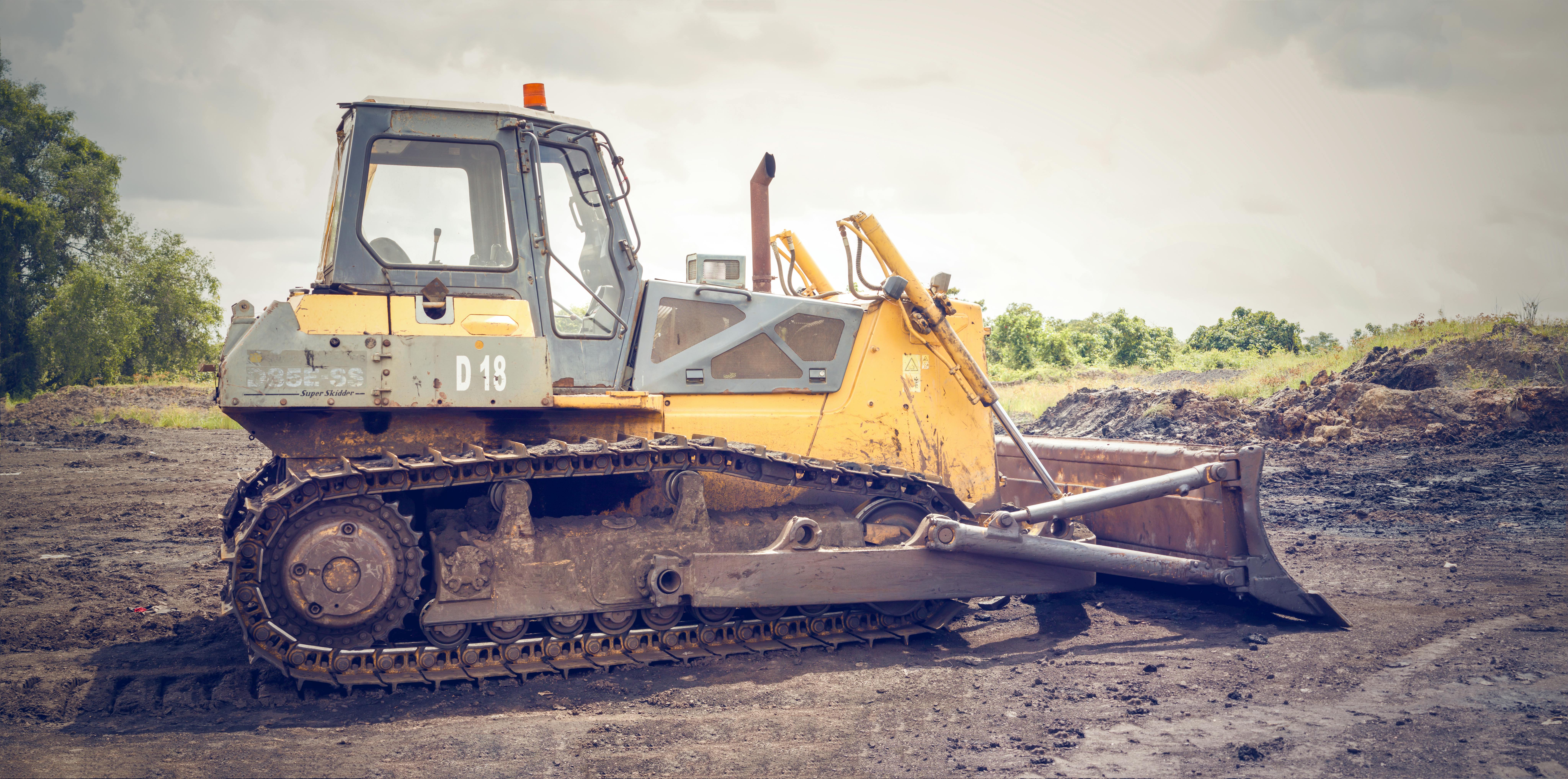 Dirty Yellow Old Bulldozer Stand On A Construction Site On A Sunny Day  Stock Photo - Download Image Now - iStock