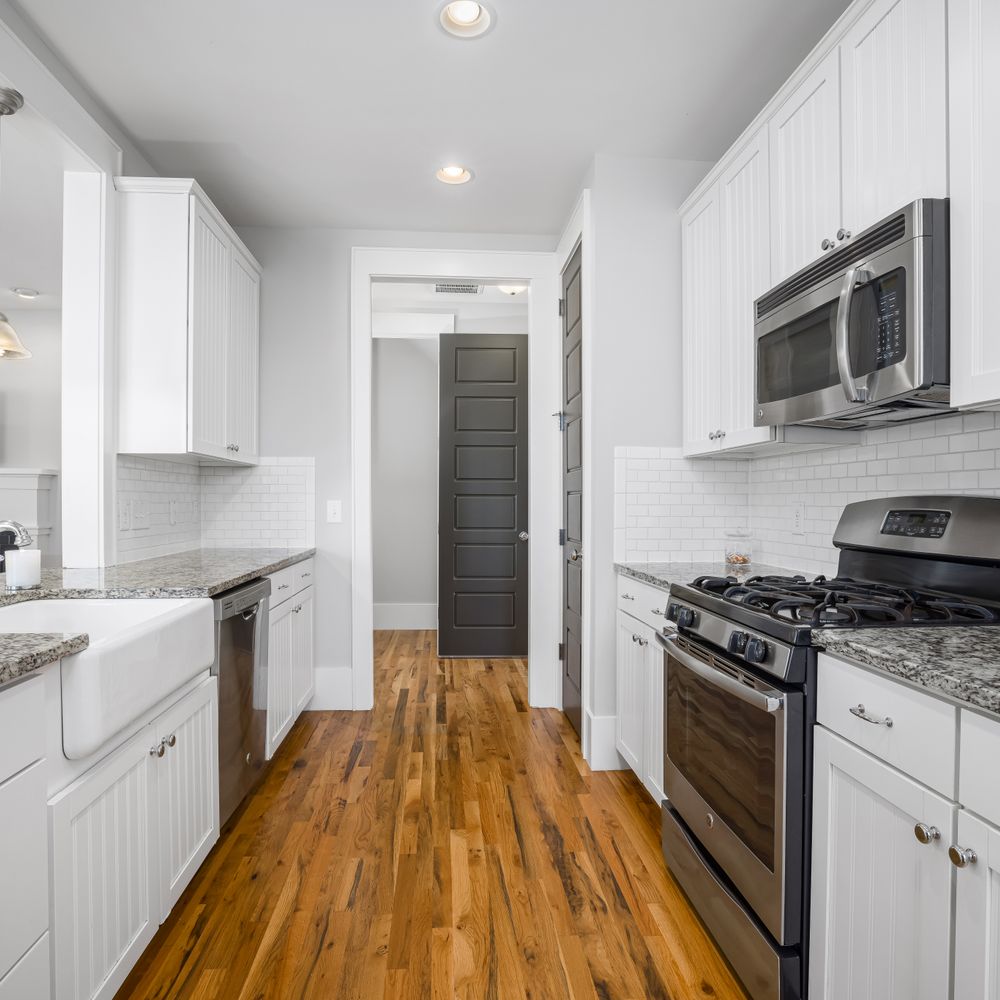 Kitchen Spraying in St Johns — careful masking before painting begins
