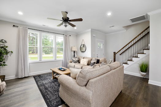 A well-lit, spacious living room with modern furnishings and a cozy ambiance.