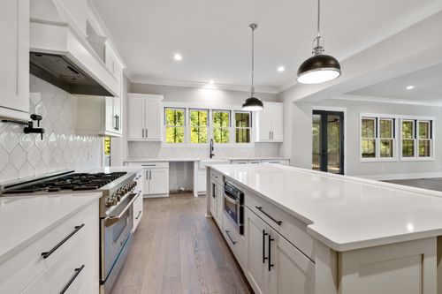 Free Bright modern kitchen with white cabinets and large island countertop. Stock Photo