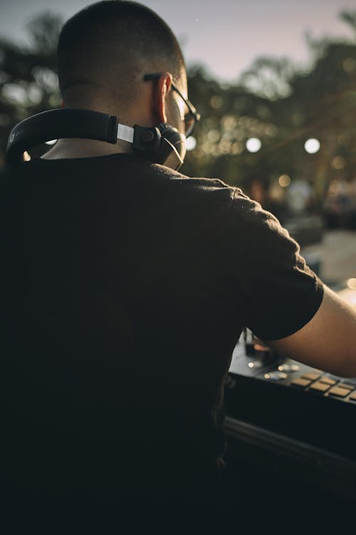 Man in Black Shirt With Black Headphones