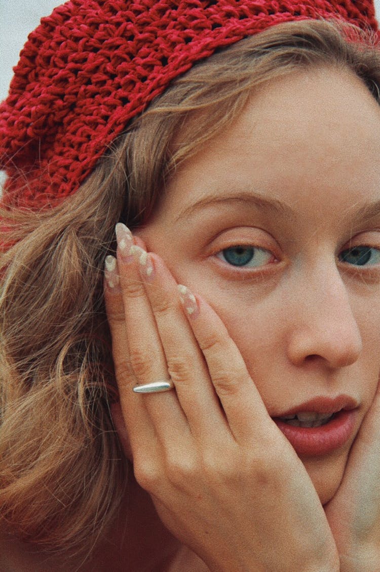 Blond Woman In Red Cap