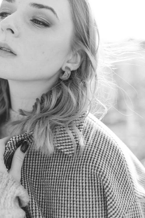 A Pretty Woman in Black and White Coat