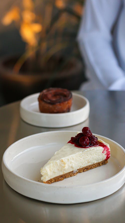 Sliced of Cheesecake on White Ceramic Plate