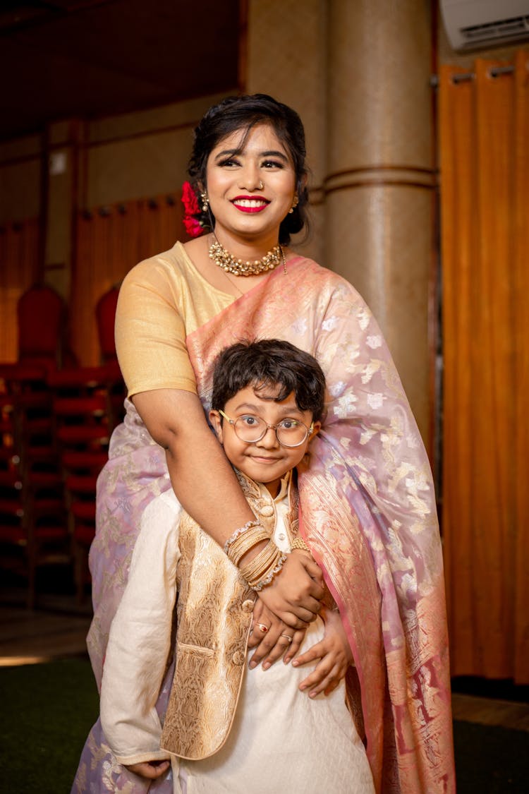 Portrait Of A Mother And Son Posing Together In Traditional Clothing