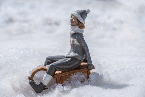Gray and White Figurine in Close Up Photography
