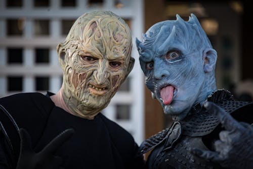 Two People Wearing Spooky Halloween Masks