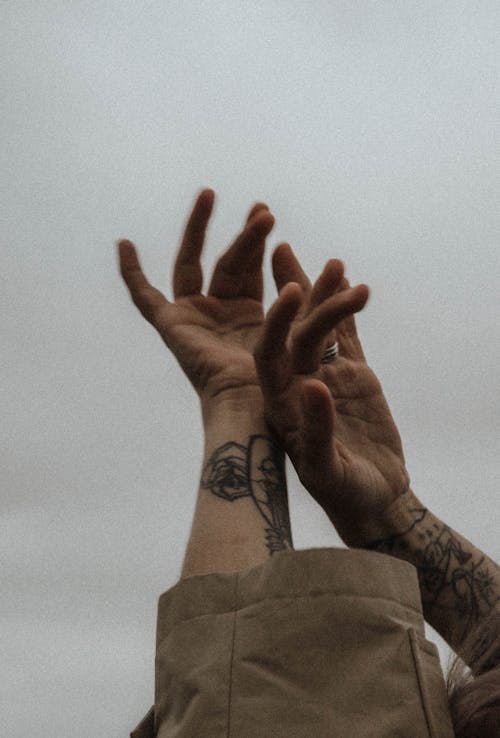 Photograph of a Person's Arms with Tattoos