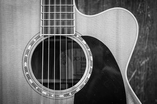 Grayscale Photo of Cutaway Acoustic Guitar