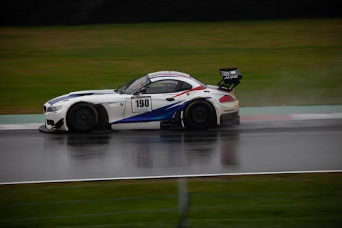 A White Bmw Z4 in a Wet Race Track