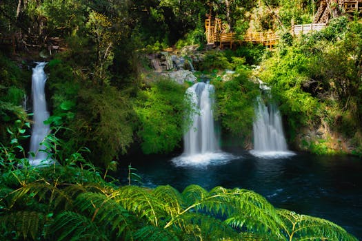 Beautiful cascading waterfalls surrounded by lush greenery in Pucón, Araucania, Chile.