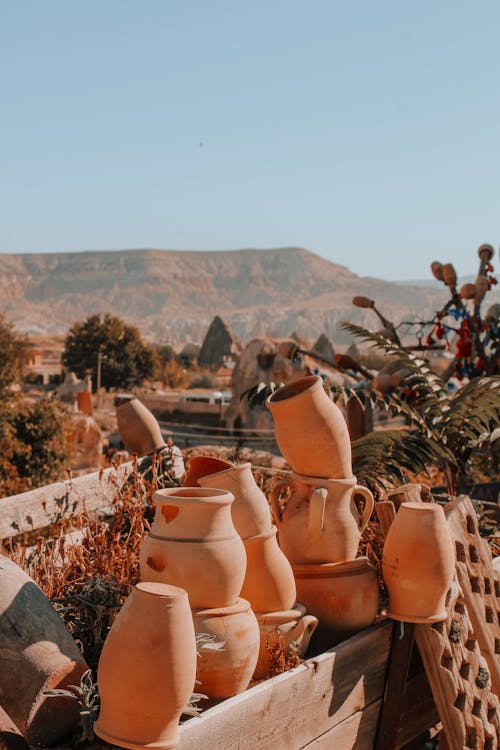 Brown Clay Pots on Wooden Box