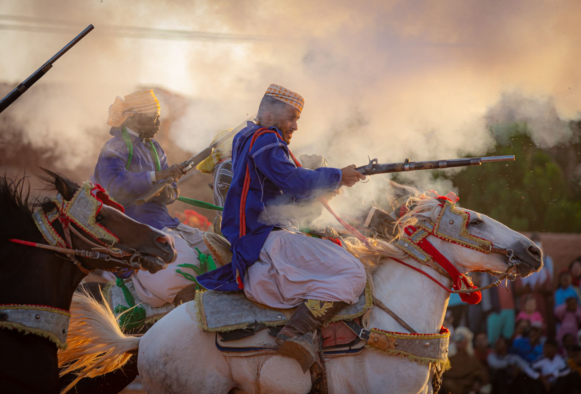 Vibrant Algerian festival with traditional costumes, horses, and cultural reenactment displays.
