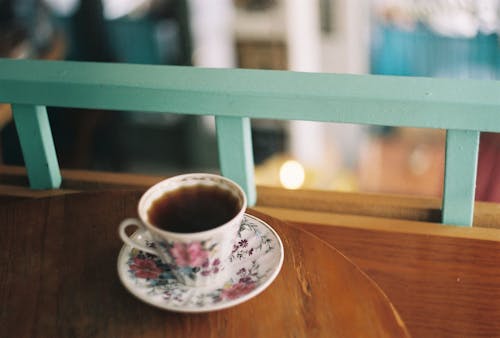 Free Cup of Coffee on a Wooden Table Stock Photo