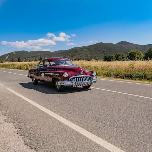 Classic Car Driving on the Road